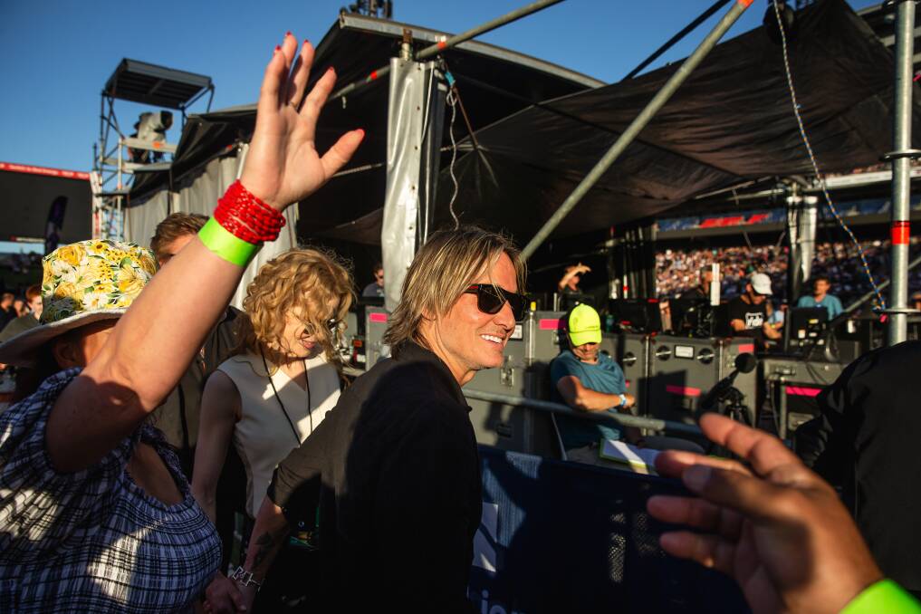 Nicole Kidman and husband Keith Urban, joined by Channel Nine entertainment presenter Richard Wilkins, caused a stir among the crowd as they walked into the VIP section behind the sound desk just prior to showtime at Newcastle's Elton John concert on Sunday. Picture by Marina Neil.