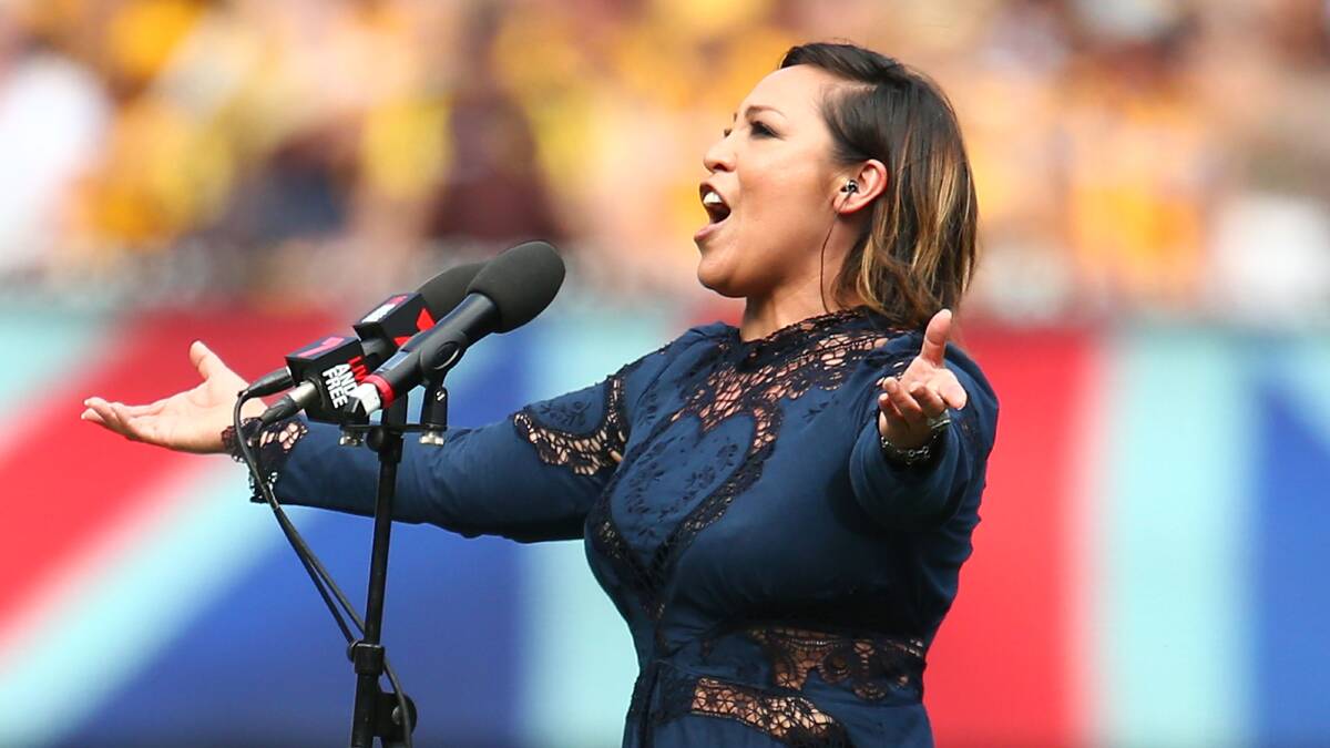 Kate Ceberano sings the national anthem at the 2015 AFL Grand Final match between the West Coast Eagles and the Hawthorn Hawks at the MCG. Picture: Scott Barbour
