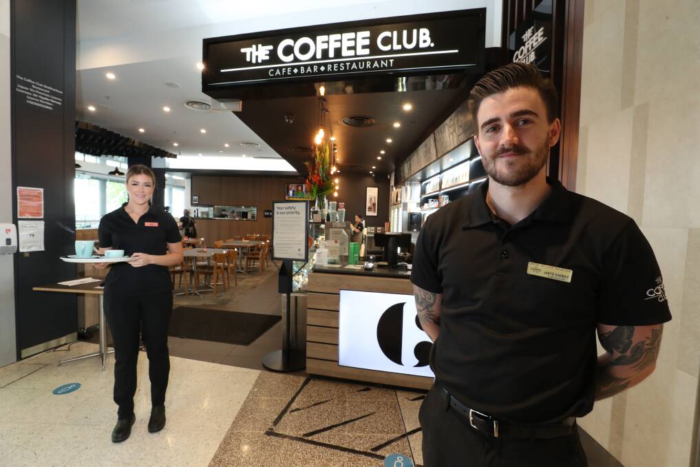 Kira Ramsey and Jaryd Ramsey run the Coffee Club Shellharbour, which are 60 per cent down in customers due to COVID. Picture: Robert Peet