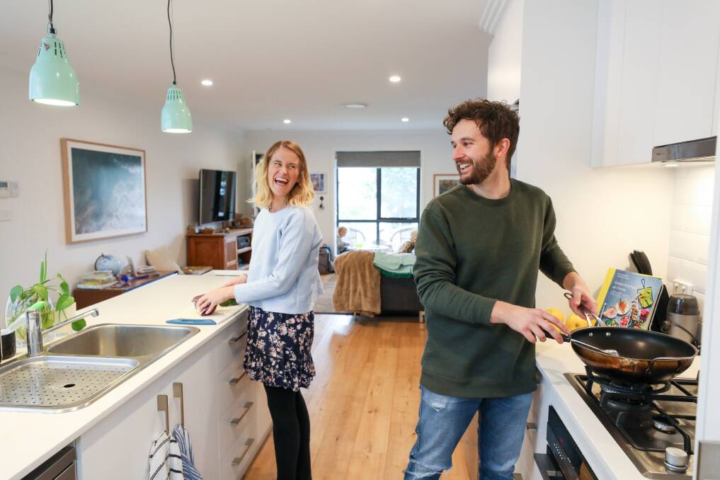 FUN IN THE KITCHEN: FLO co-founder Kirsten Hitchins (pictured with husband Alex) says gifting a meal is an easy way to help someone in need without it denting their dignity. Picture: Adam McLean
