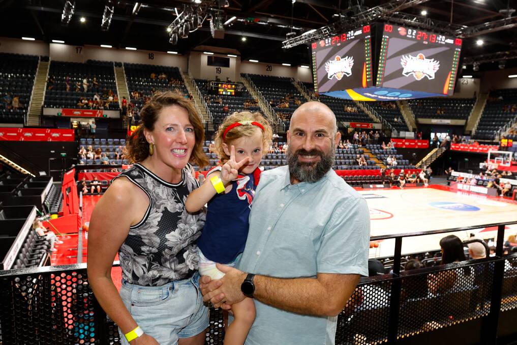 Desiree Savage and Simon Cohen take Miss G, 4, to her first Illawarra Hawks game on Sunday January 28, when they took on the New Zealand Breakers. Picture by Anna Warr.