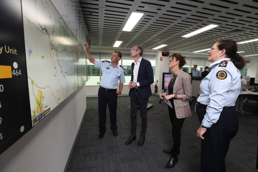 NSW SES Deputy Commissioner Daniel Austin, NSW Premier Dominic Perrottet, Minister for Emergency Services and Resilience Steph Cooke and NSW SES Commissioner Carlene York visit the SES headquarters in Wollongong on Sunday. Picture: Robert Peet