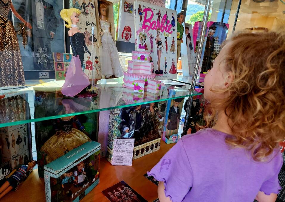 A child stares in awe at the collection of rare Barbies and other dolls on display ahead of the Wollongong Doll Club's annual fair at Dapto on Saturday October 21. Picture by Desiree Savage