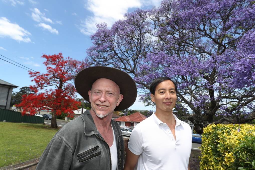 Gary Carsley and Renjie Teoh want the public to send them locations and photographs of Illawarra flame trees to thearthitects@thearthitects.org. Picture: Robert Peet