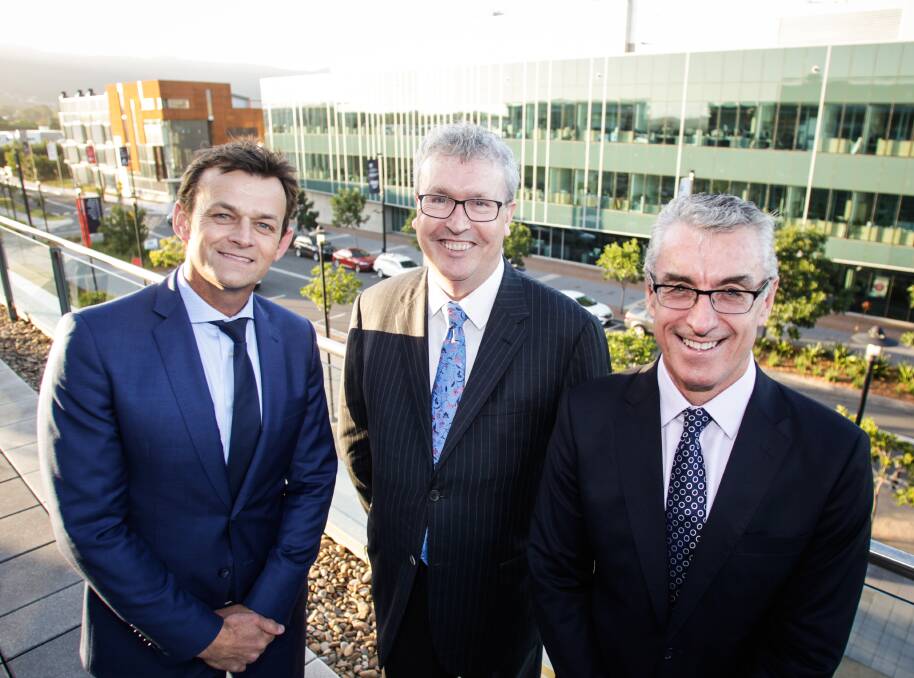 HAPPY BIRTHDAY: Adam Gilchrist, Professor Paul Wellings and Damien Israel celebrating the 10th anniversary of the Innovation Campus. Picture: Georgia Matts 