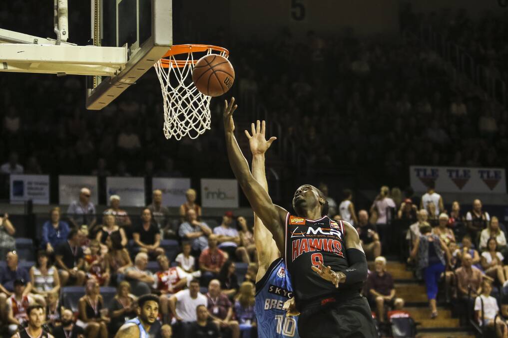 BATTLE: Hawks guard Cedric Jackson takes it to the rim in his side's clash with New Zealand on Saturday night. Picture: Anna Warr