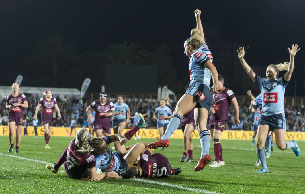 HOW GOOD: NSW celebrate Isabelle Kelly's match-winner on Friday night. Picture: AAP