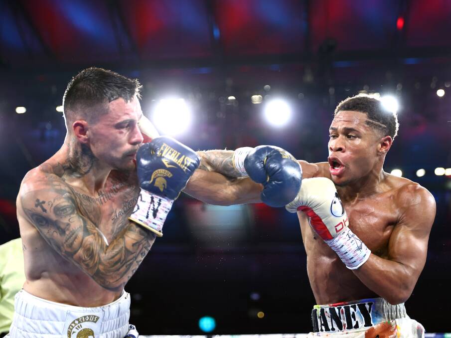 JABBED: George Kambosos (left) fell short in his bid to become the undisputed lightweight champion of the world against American Devin Haney on Sunday. Picture: Getty Images