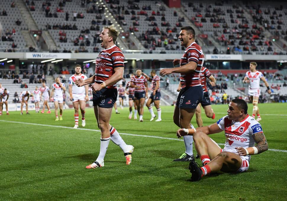 MILESTONE: Mitch Aubusson celebrates his try in the Roosters win over the Dragons on Thursday. 