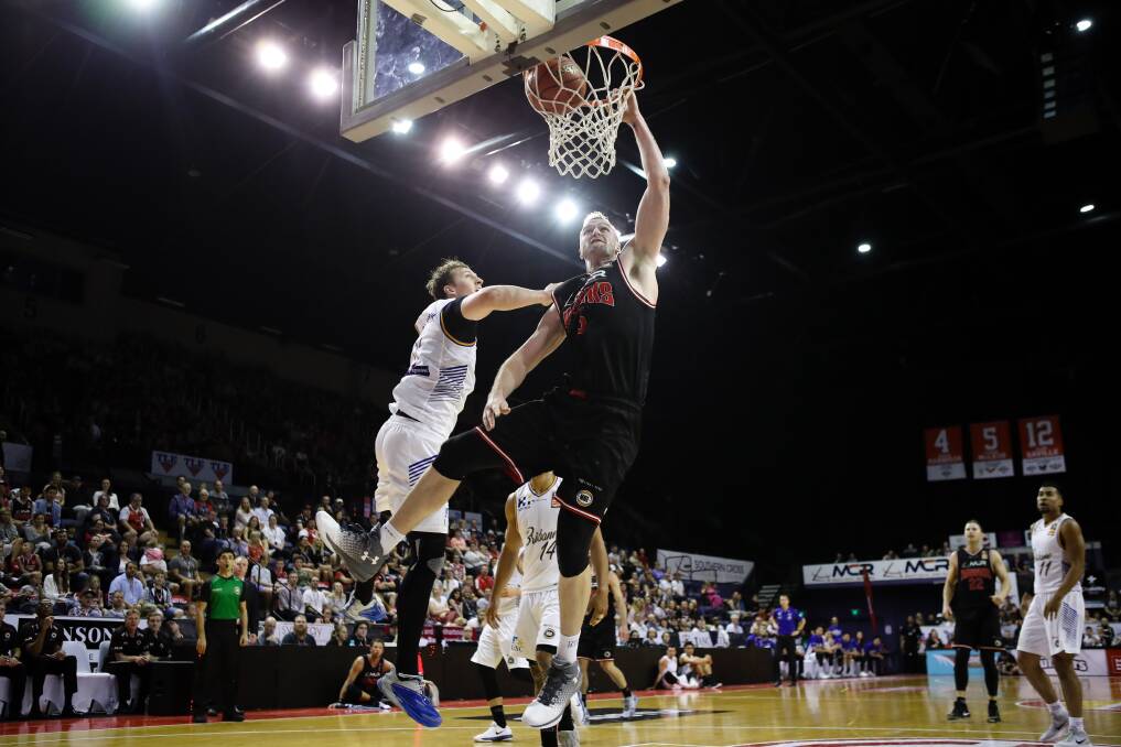 INSIDE MAN: Hawks centre AJ Ogilvy goes hard to the basket in his side's win over Brisbane on Saturday night. Picture: Adam McLean
