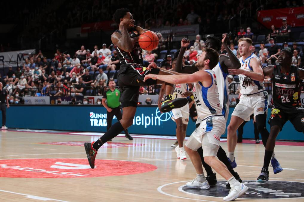 CLASH: Hawks import Antonius Cleveland collides with Melbourne United star Matthew Dellavedova on Sunday afternoon. Picture: Sylvia Liber