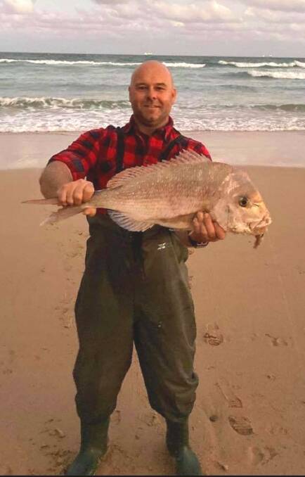 SNAP THIS ONE: Adam Goode proudly displays his beach-caught 70-centimetres snapper - a PB for the keen angler.