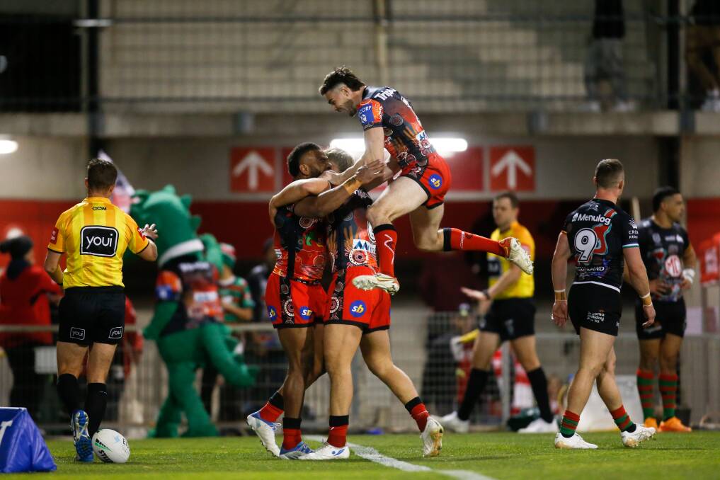 HOW GOOD: The Dragons celebrate Mikaele Ravalawa's try against the Rabbitohs on Thursday. Picture: Anna Warr