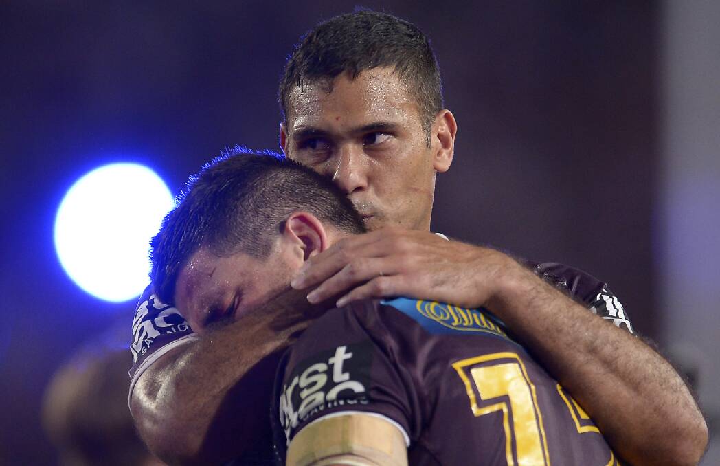 HEARTBREAK: Retiring Brisbane captain Justin Hodges consoles Matt Gillett after Jonathan Thurston's grand final heroics dashed the Broncos hopes. Picture: Getty Images