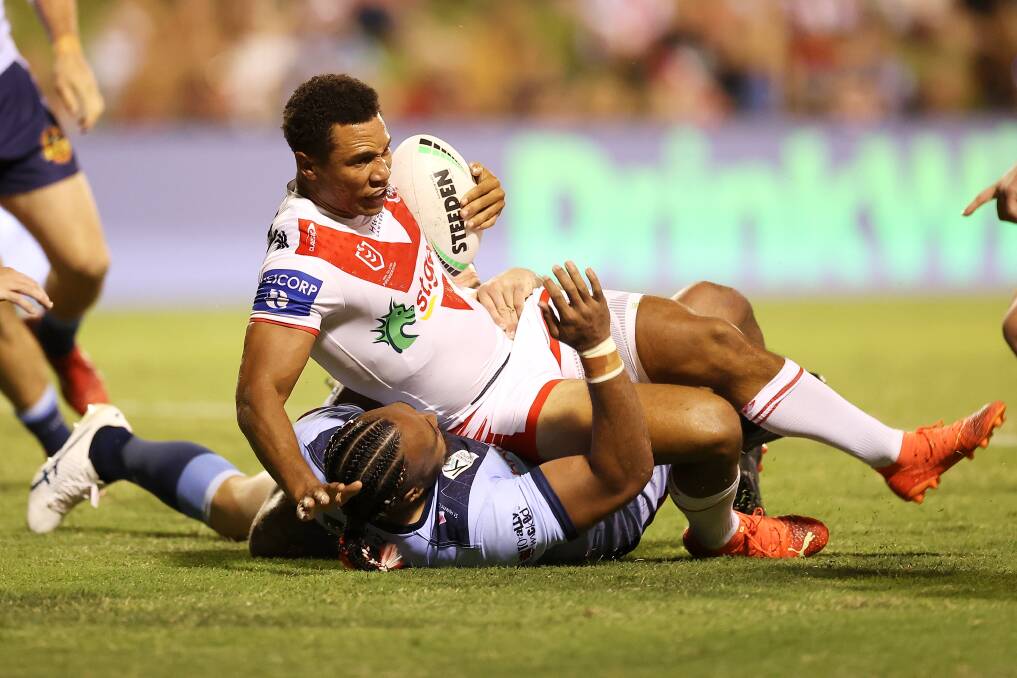 Moses Mbye take on the St Helens defence on Saturday. Picture - Getty Images