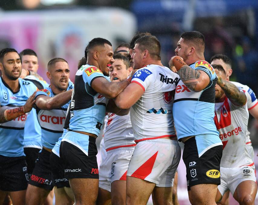 FIRE: Blake Lawrie comes to grips with the Sharks on Sunday. Picture: NRL Imagery