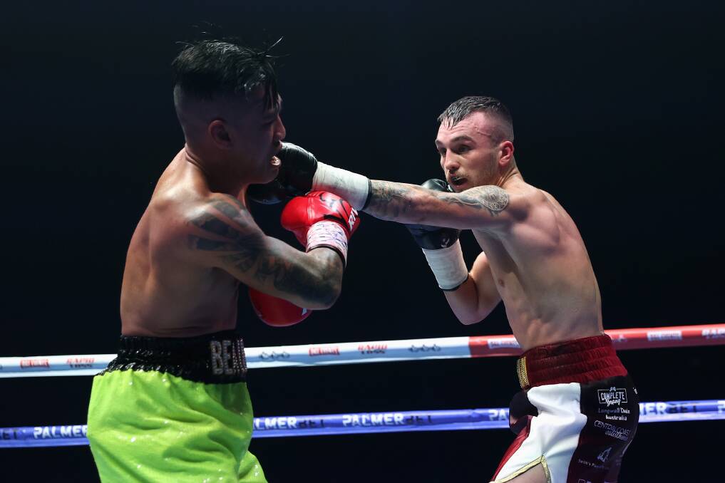 AT WILL: Sam Goodman lands flush on Nort Beauchamp in their featherweight bout. Picture: Getty Images