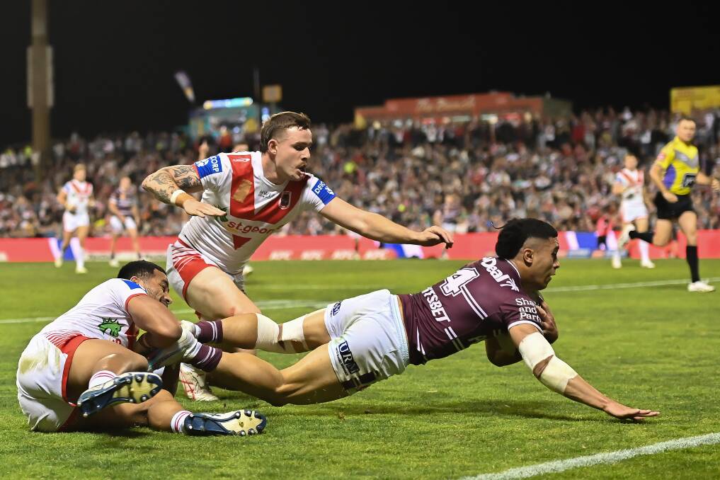 Tolutau Koula crosses for the Sea Eagles on Saturday. Picture Getty Images