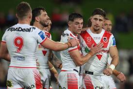 The Dragons celebrate Zac Lomax's crucial two-point field goal on Saturday night. Picture Getty Images 