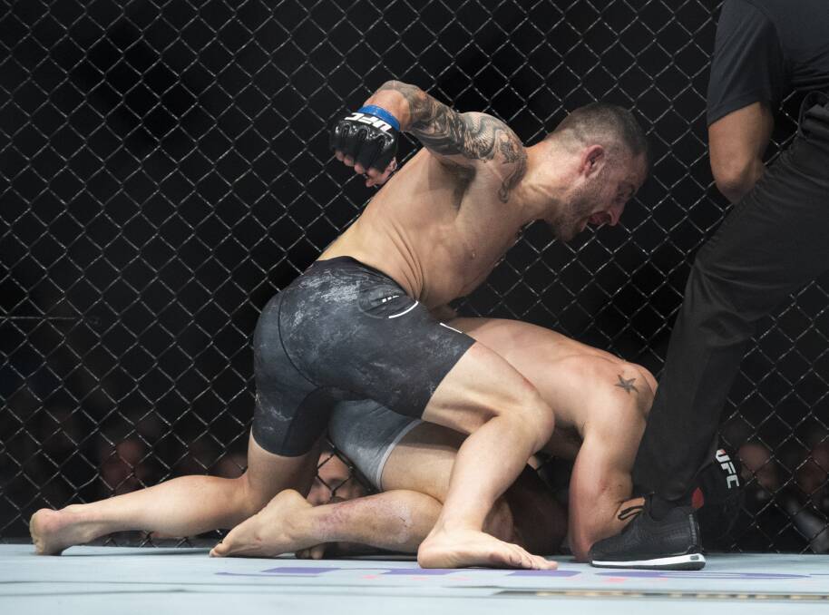 DEMOLTION: Alexander Volkanovski stops three-time featherweight title contender Chad Mendes in the second round of their bout at UFC 232. Picture: AP