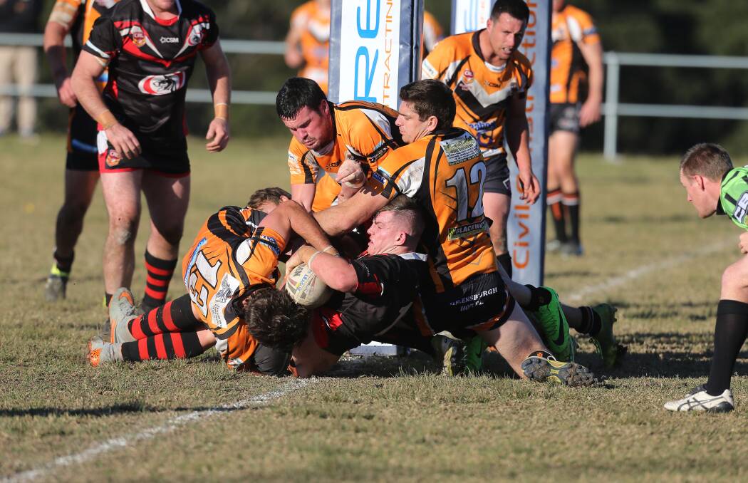 PILING ON: Collegians prop Matt Jurd gets across the try-line in the Dogs 48-12 win over Helensburgh on Saturday. Picture: Robert Peet