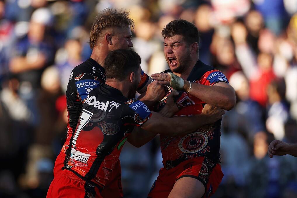 HOW GOOD: The Dragons celebrate Blake Lawries breakthrough four-pointer against the Bulldogs on Sunday. Picture: Getty Images