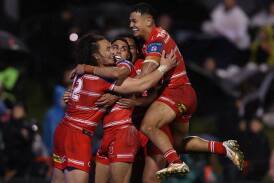 The Dragons celebrate Tyrell Sloan's second-half try against the Panthers on Saturday. Picture Getty Images