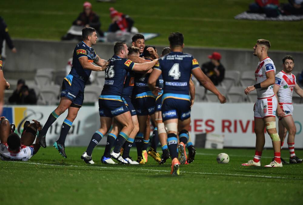 THRILLER: The Titans celebrate their last-gasp victory over the Dragons on Friday. Picture: NRL Imagery