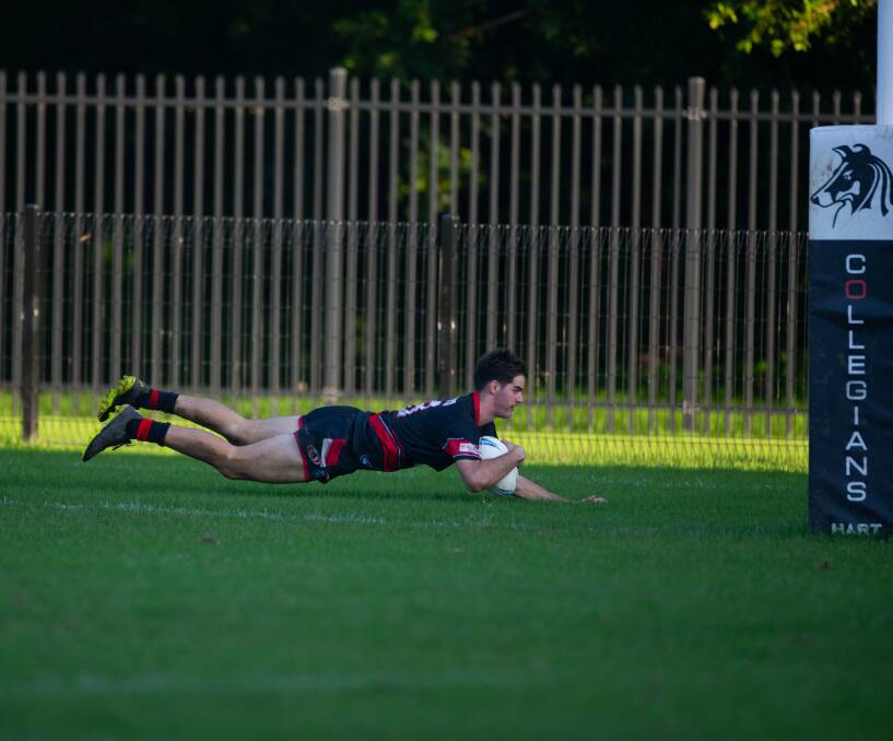 DOUBLE: Collies centre Ben Rumble crosses for the second of his two tries against Corrimal on Saturday. Picture: Anna Warr