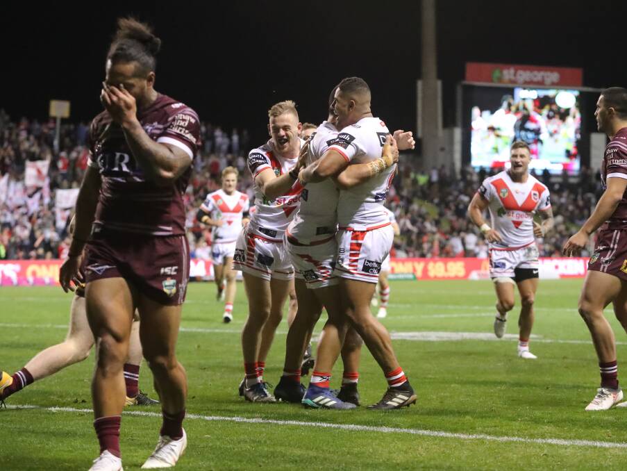 BACK ON TOP: The Dragons celebrate Tim Lafai's first-half try in their 32-8 win over Manly on Saturday night. Picture: Robert Peet