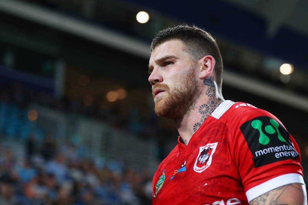 BUSTED: Josh Dugan leaves the field in the Dragons loss to the Titans. Picture: Getty Images