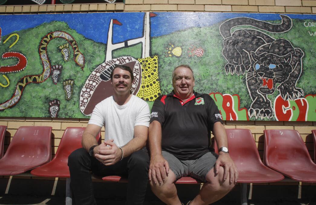 COMMUNITY SPIRIT: Indigenous artist Zachary Bennett-Brook and Corrimal Cougars president Dave Adams at the newly unveiled mural at Ziems Park. Picture: Georgia Matts