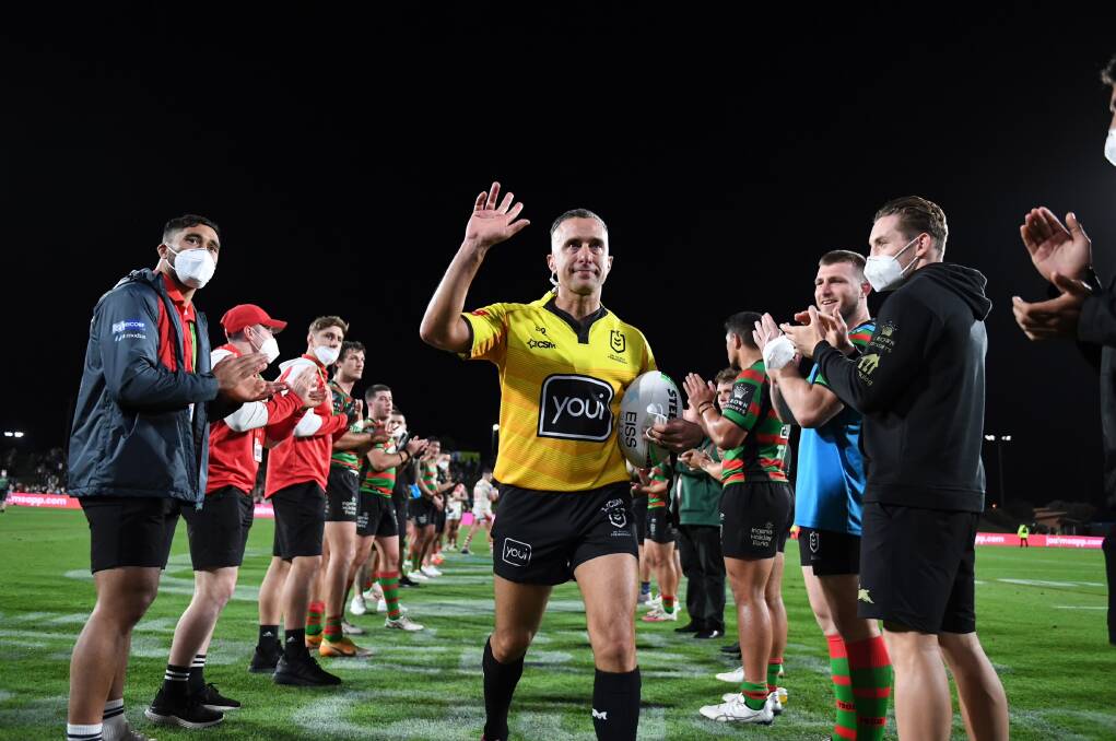 RESPECT: Matt Cecchin is clapped from the park after refereeing his final NRL game last season. Picture: NRL Imagery