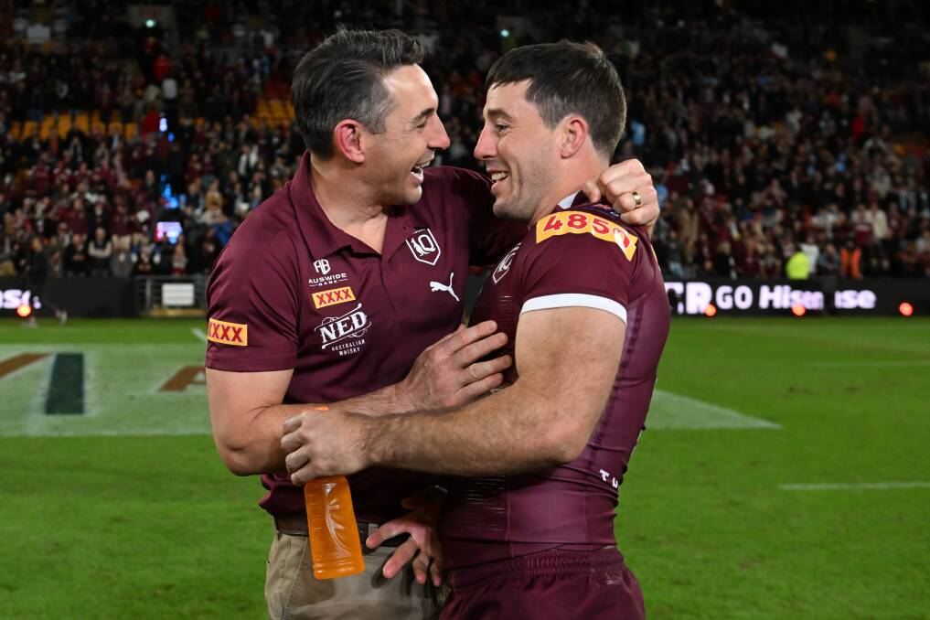 NICE: Queensland coach Billy Slater and Ben Hunt celebrate victory in Wednesday's decider. Picture: Getty Images