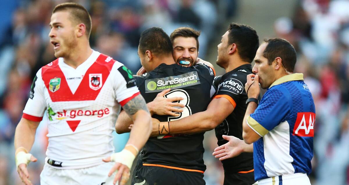 HUGE BLOW: Tigers players celebrate James Tedesco's first half try in their 25-12 win over the Dragons at ANZ Stadium on Sunday. Picture: Getty Images