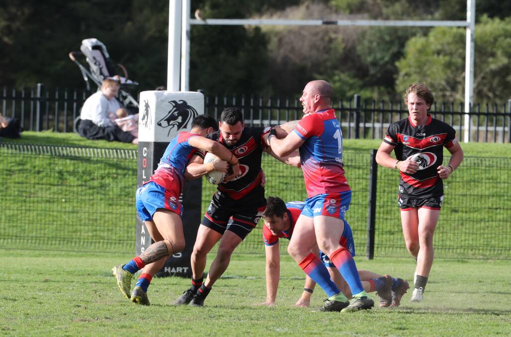 BLITZ: Collies centre Jason Gillard tangles with the Devils defence in his side's 22-16 win on Saturday. Picture: Robert Peet