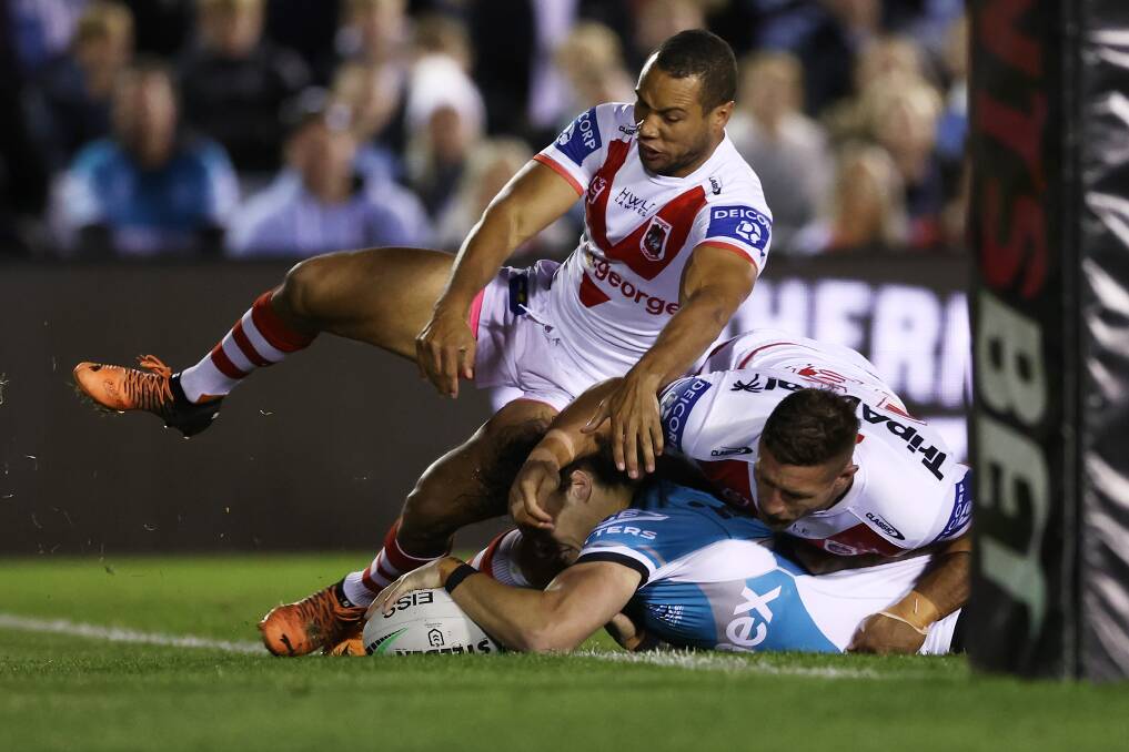 BLITZ: Nicho Hynes crossed for the Sharks against the Dragons on Saturday. Picture: Getty Images