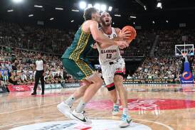 Will Magnay (left) and Sam Froling tussle in the paint. Picture Getty Images