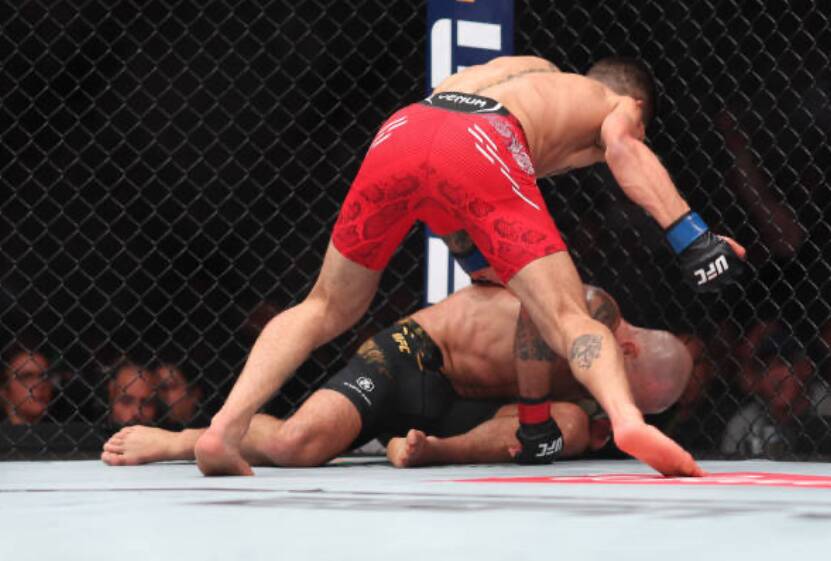 Ilia Topuria finishes Alex Volkanovski at UFC 298 on Sunday. Picture Getty Images