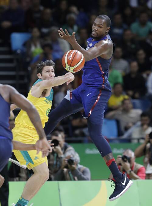 MOMENT IN TIME: Damian Martin picks US megastar Kevin Durant's pocket at the Rio Olympics. Picture: AP