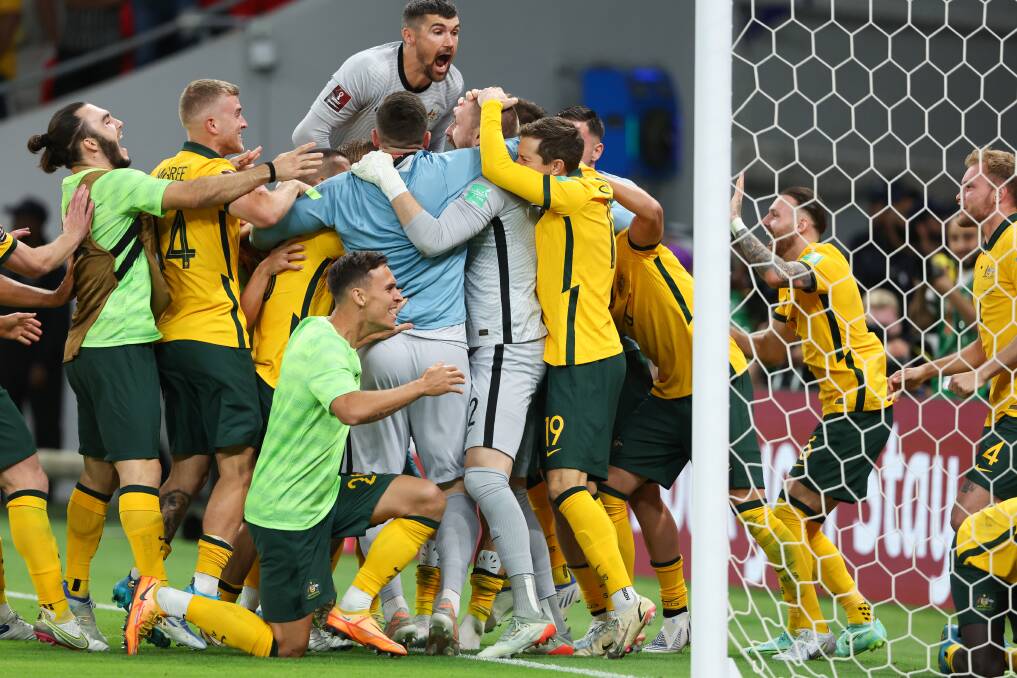 HOW GOOD: The Socceroos celebrate the Andrew Redmayne save that booked their passage to the World Cup. Picture: Getty Images