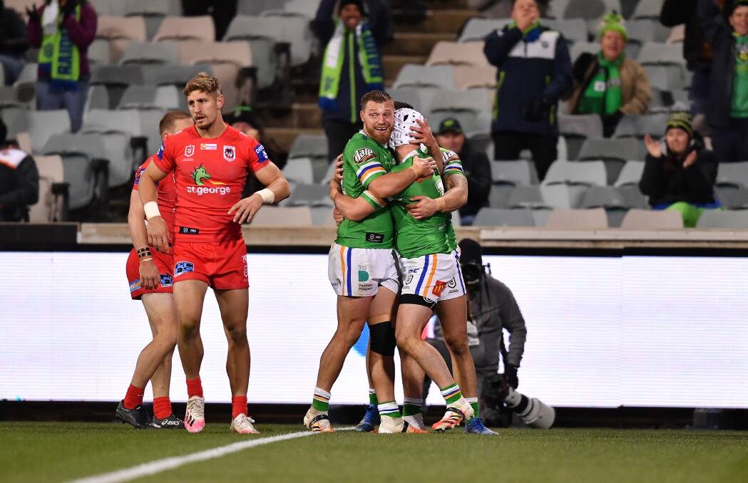 TOUGH NIGHT: The Raiders celebrate Jarrod Croker's second-half try that sunk the Dragons on Friday night. Picture: NRL Imagery