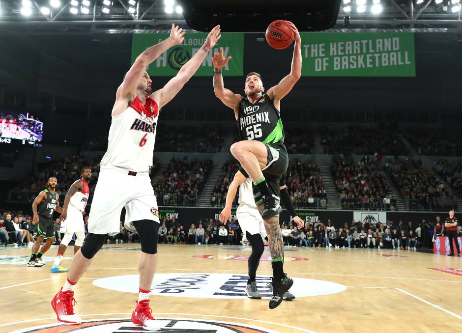 BATTLE: The Hawks had no answer for Phoenix stars Mitch Creek (right) and John Roberson on Saturday night. Picture: Getty Images