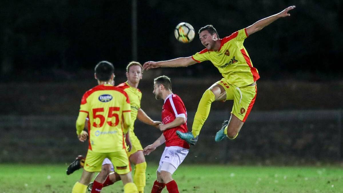 RETURNING: Wollongong United defender Ben Brooks (right) played in his team's loss to Port Kembla on Thursday night. Picture: ADAM McLEAN