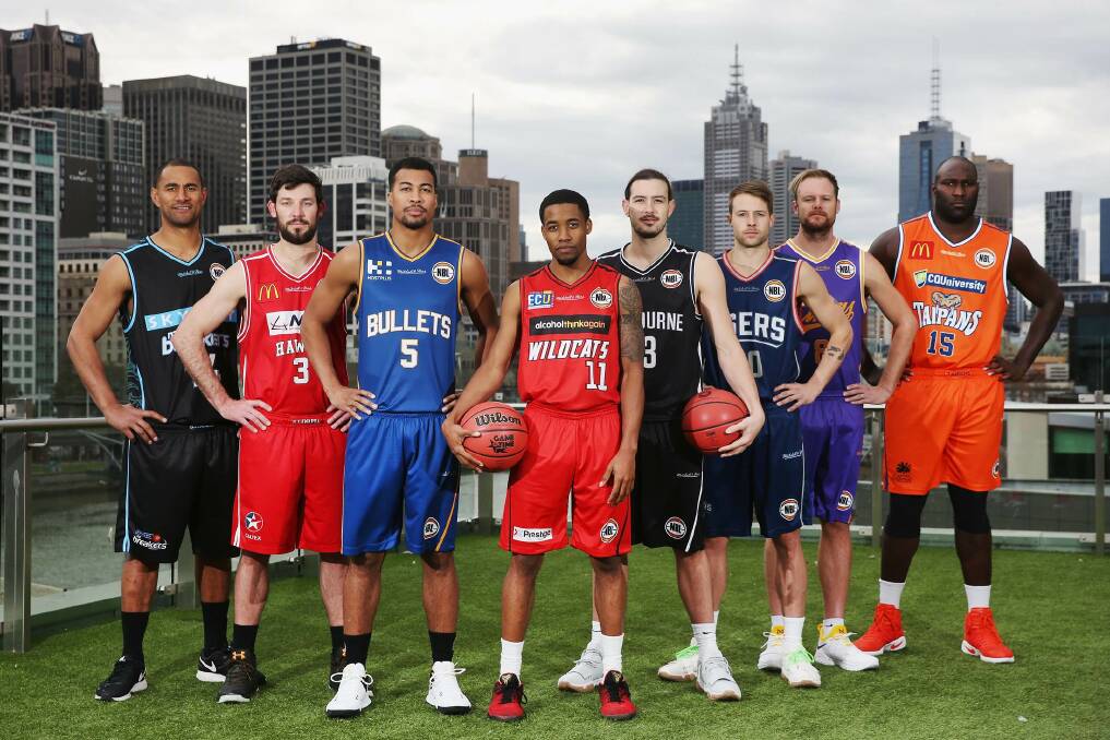READY FOR ACTION: Players from all eight NBL clubs stand together at the competition's season launch in Melbourne last month. Picture: NBL