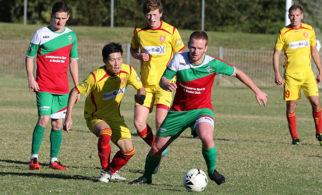 TOUGH BATTLE: Kemblawarra's Lachlan O'Connor holds off Wollongong United's Jinya An in Sunday's 0-0 draw. Picture: ROBERT PEET