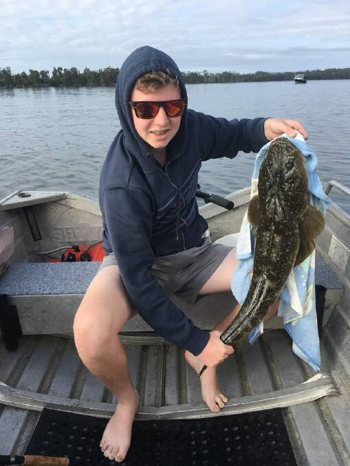 GOOD DAY OUT: Mt Warrigal's Jack Skippen with a soild basin flathead just before release.