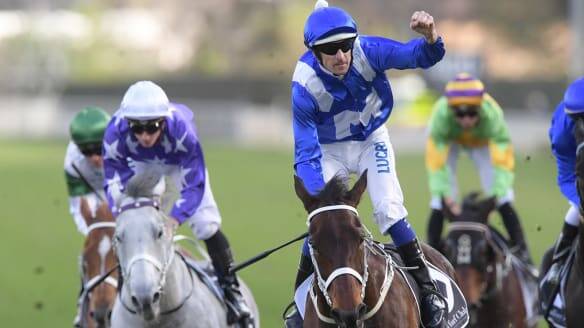 CHAMPION: Jockey Hugh Bowman salutes as the mighty mare Winx salutes at Royal Randwick. Picture: AAP