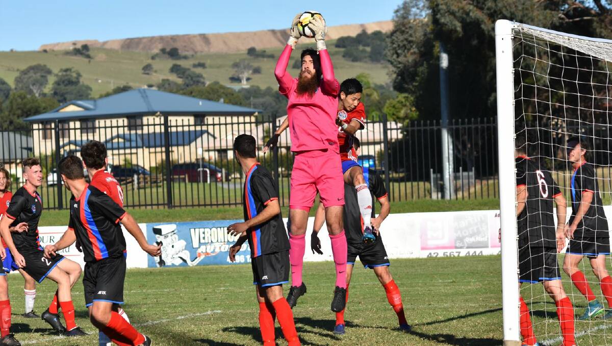 SAFE HAND: Woonona keeper Jacob Madden claims a cross against Albion Park White Eagles. Picture: SOCCER SHOT ILLAWARRA/KIAH HUFTON