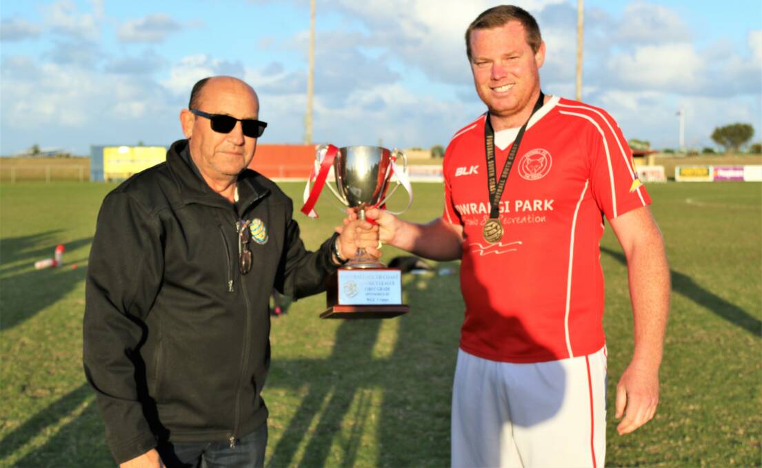 SILVERWARE: Fernhill Foxes captain Dale White receives the District League trophy after the club's draw at Ray Robinson Field on the weekend. Picture: PEDRO GARCIA